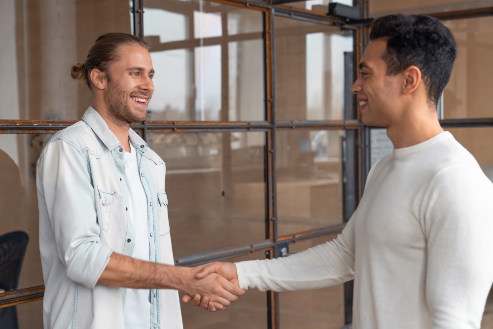 Men shaking hands to their dual diagnosis treatment