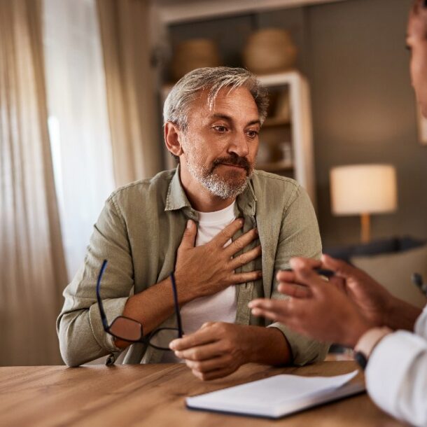 man talking to elderly professional