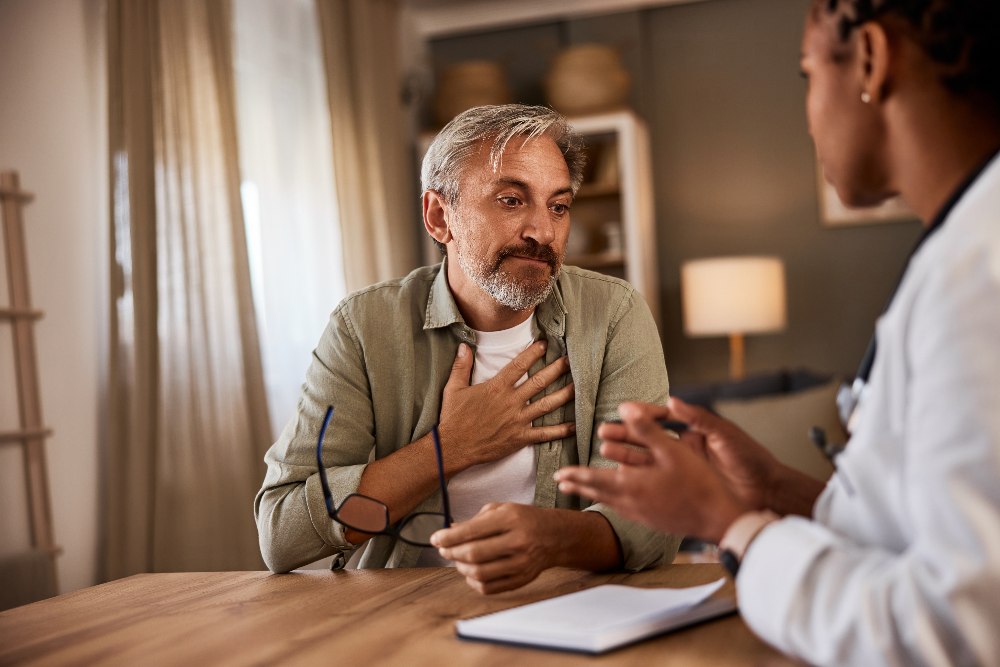 man talking to elderly professional