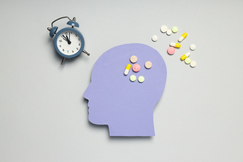 head with pills and clock
