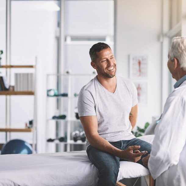 young man talking to medical professional