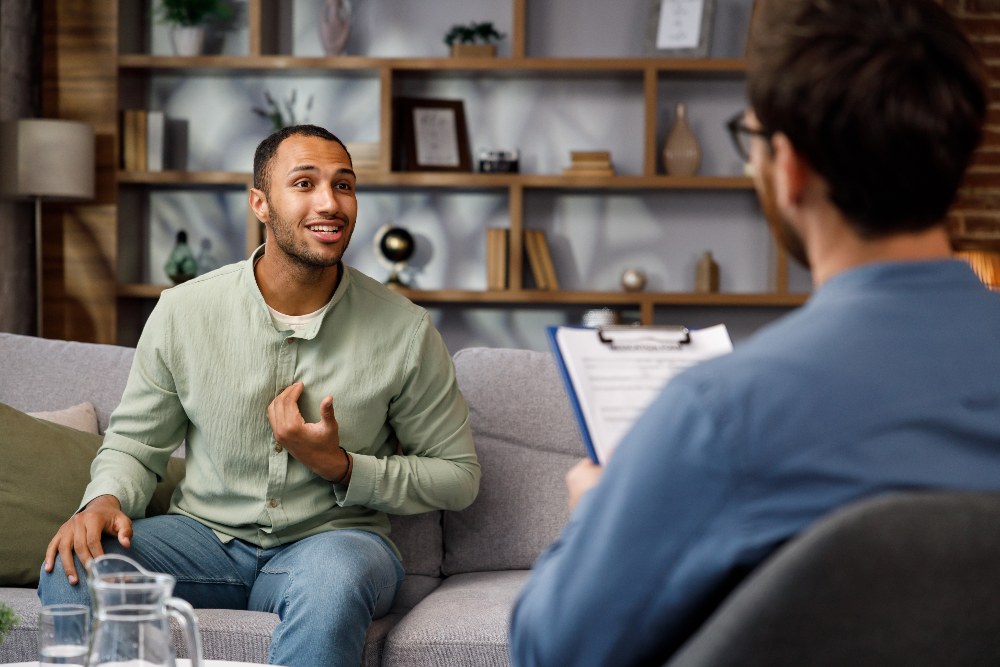 man speaking to therapist