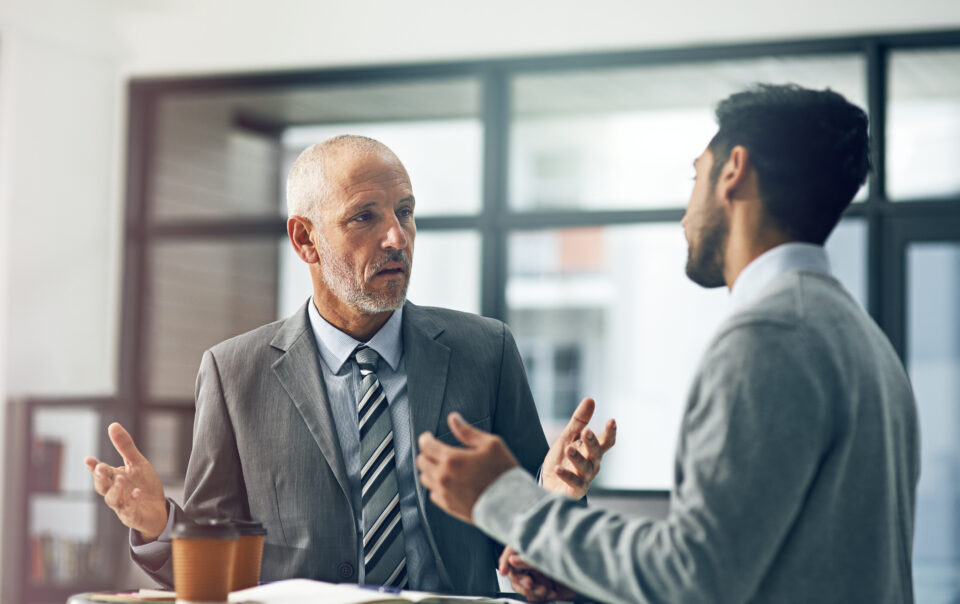 Boss and employee discussing: does an employer have to offer drug rehab before termination?