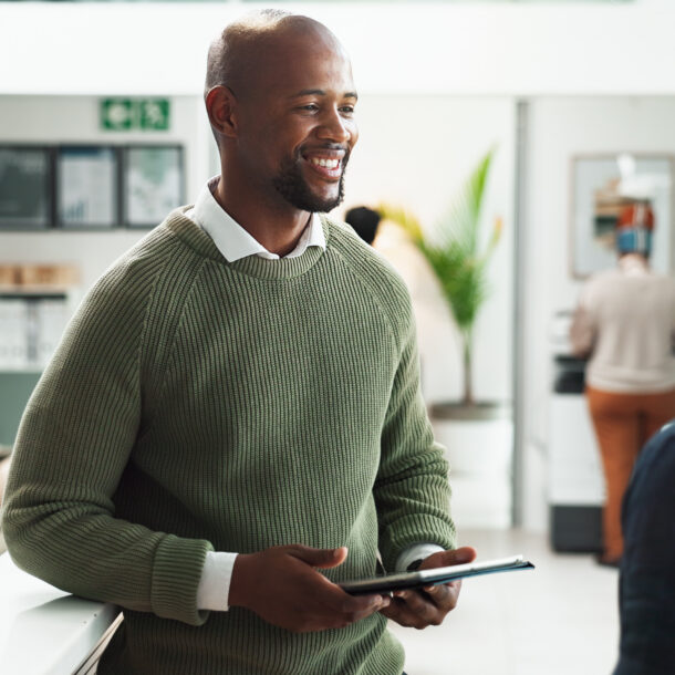 Two men in an office talking about how to pay for rehab.